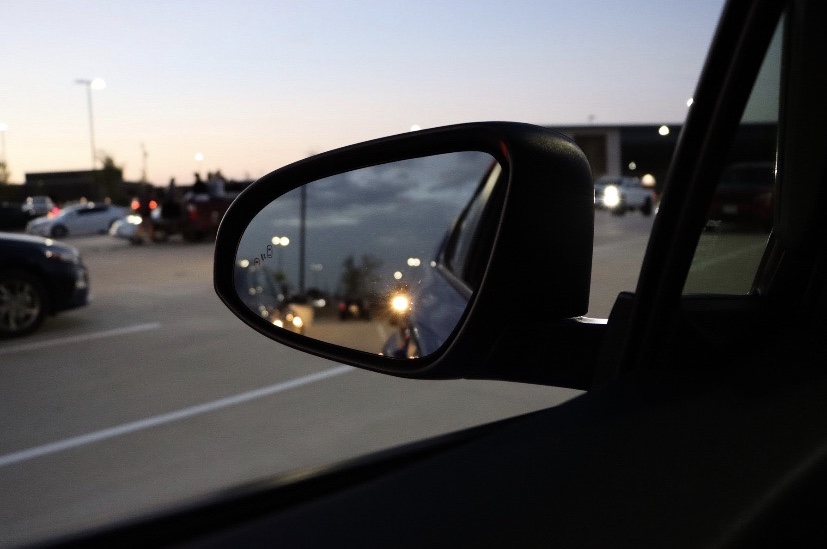 A parked car's sideview mirror watches as the night sky is erased by the sun. Seniors from both PHS and RHHS gathered this morning to watch the sunrise. Student Council passed out papers for students to write letters to their future selves, which will be passed out at the Senior Sunset at the end of the year.