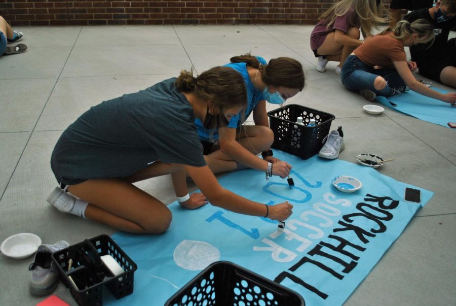 Students decorate posters at the school's first ever Forthcoming Sign-Painting event last Sunday, Oct. 18th. Students were encouraged to attend and create posters for their organization. "I wanted to make the signs so that we can represent the soccer team," sophomore Callie Romero said. "It helps me connect with the school more."  