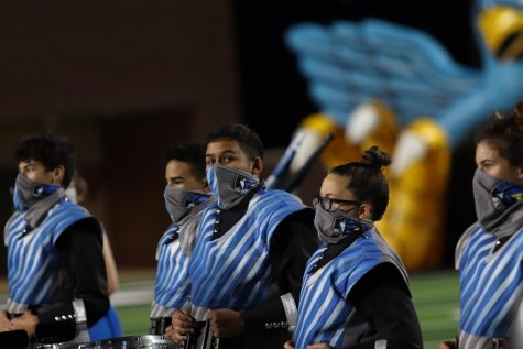 Juan Vera-Gonzalez waits to perform with the rest of the drum line Friday, Oct. 3. Even though the football game was canceled, band, color guard and the Rockettes still performed their half-time performance at Children's Health Stadium. This week's football game has been postponed to Saturday, Oct. 10.