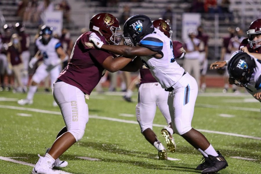 A Blue Hawks player blocks a Frisco Heritage Coyote while a teammate is tackled in the back. The Blue Hawks lost their first game against Frisco Heritage 35-61. Their Oct. 2 home game was canceled this week due to COVID-19 safety concerns.