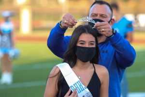 Principal Dustin Toth crowns Forthcoming Duchess Isabella Wikander at the community pep rally Thursday, Oct. 22. Underclassmen courts were crowned together at the rally. Senior king and queen, Shallan Marcum and Jimmy Peterson, were announced at the varsity game Friday, Oct. 23. 