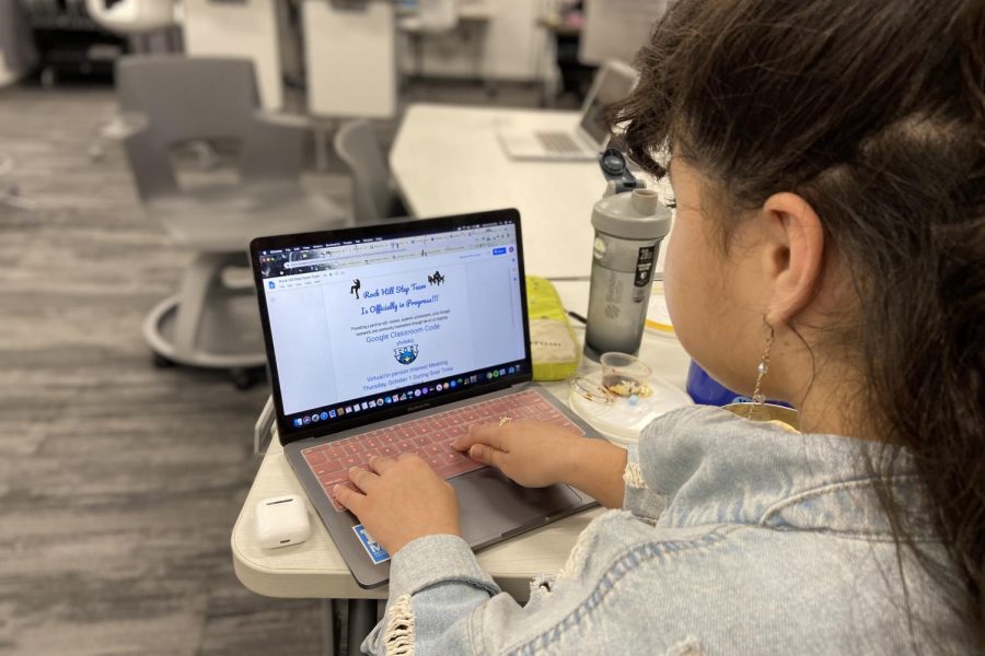 Assistant editor Gianna Ortner-Findlay looks at the Step Team flyer. Students online and in person can join the step team, but all practices will be in person. "They (students) can still come on Monday," Ballou said. "to kind of feel it out to see if this is something they actually want to do." 