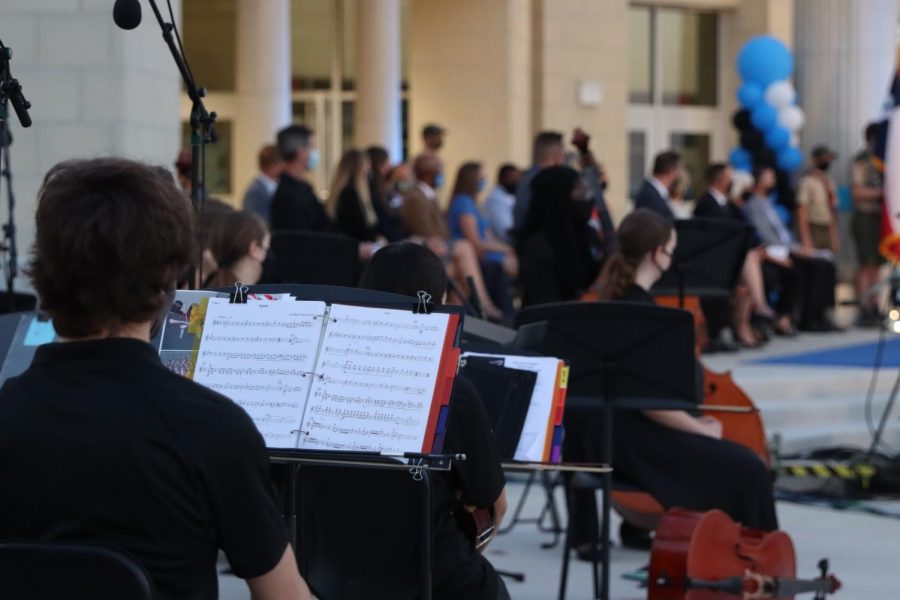 Orchestra members listen to principal Dustin Toth's speech at the ceremony. Orchestra performed at the beginning of the ceremony as people arrived and found their seats. The Ribbon Cutting ceremony was from 5 p.m. to 6 p.m. Nov. 7. 