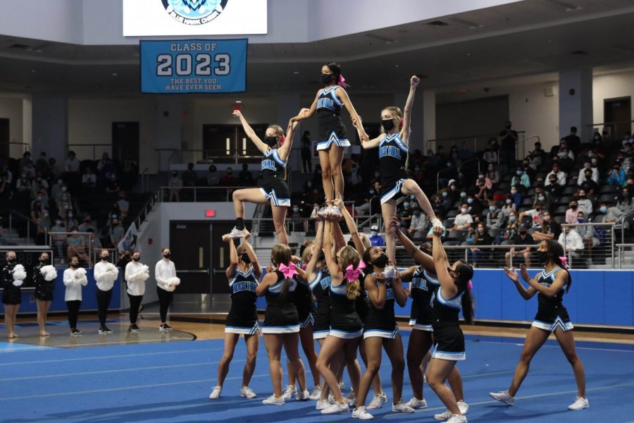 Cheer performs a routine at the Black Out pep-rally. Only seniors and freshmen attended the rally in-person due to coronavirus concerns. Students and staff celebrated for varsity football's last game tonight. 