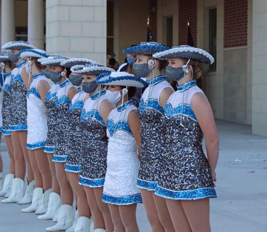 The Rockettes stand in line before performing for the community. Other student performers such as band and color guard were also showcased at the event. The school had originally scheduled the event before the first day of school, but due to coronavirus concerns, the district rescheduled. 