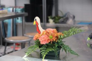 A Thanksgiving-themed floral arrangement sits in the floral classroom before the break. Floral students designed and constructed these arrangements for the Thanksgiving holiday. Students have a few more weeks of classes before the Christmas break. 