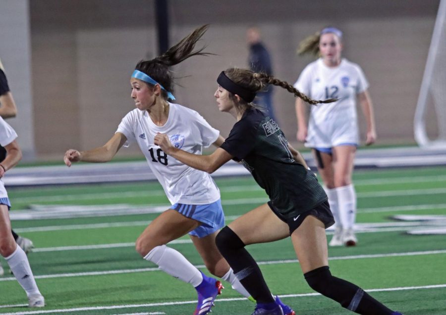 Sophomore forward Noemi Mistretta runs for the ball while Prosper player trails closely. The team lost against their PISD counterpart, but will play against Belton High School next week. The game will be at the PISD stadium.