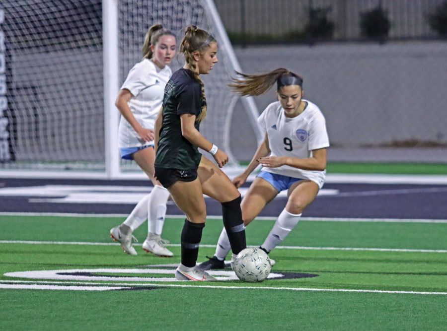 Sophomore Avery Wheeler defends against Prosper player. The team will play again at Children's Health Stadium against Belton High School Dec. 19. The game will be at 12:30 p.m.