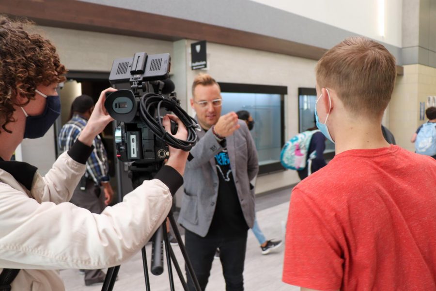 TEDx Speaker Collin Kartchner speaks with Grant Johnson and Beau Cormican  after his presentation at the high school. Kartchner passed away from a life-threatening condition Oct. 20, 2020. “I started this movement three years ago because of my family friend who ended up dying from suicide,” Kartchner said in an interview following his speech. “Later we found out that so much of it had to do with the stress and anxiety from social media.”