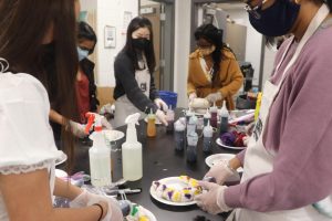 National Art Honor Society tie dyes t-shirts at their Halloween social in October. The society will host their induction ceremony Jan. 14. 