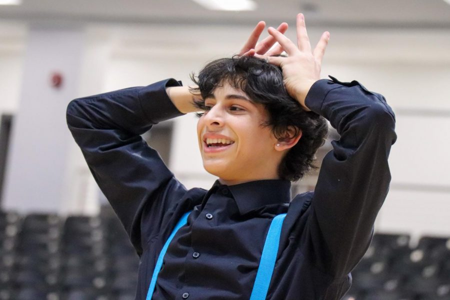 Sophomore Rami Shihabi dances at a pep rally as the only male on the Rockette drill team. He is the first boy to perform with the Rockettes. “The first time I saw Rami dance I was astounded at his ability to pick up movement,” junior Gracie Fisher said. “If the teacher told him to do something he would just go for it and nail it the first try. He is never afraid of a challenge.” 