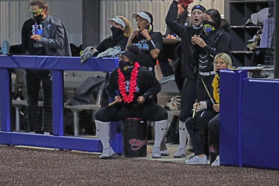 The softball team rallies together during a game. The team supports each other throughout the game. "We do a lot of celebrating. We celebrate all the little things because this game is a game of mistakes," junior Katerina Luna said. "Everything that we do correct, we always just try to celebrate just to stay hyped through the game."