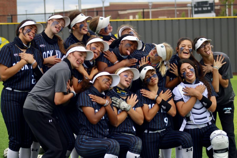 The girls softball team celebrates their district win. In their inaugural year, the girls became 5A district champs.