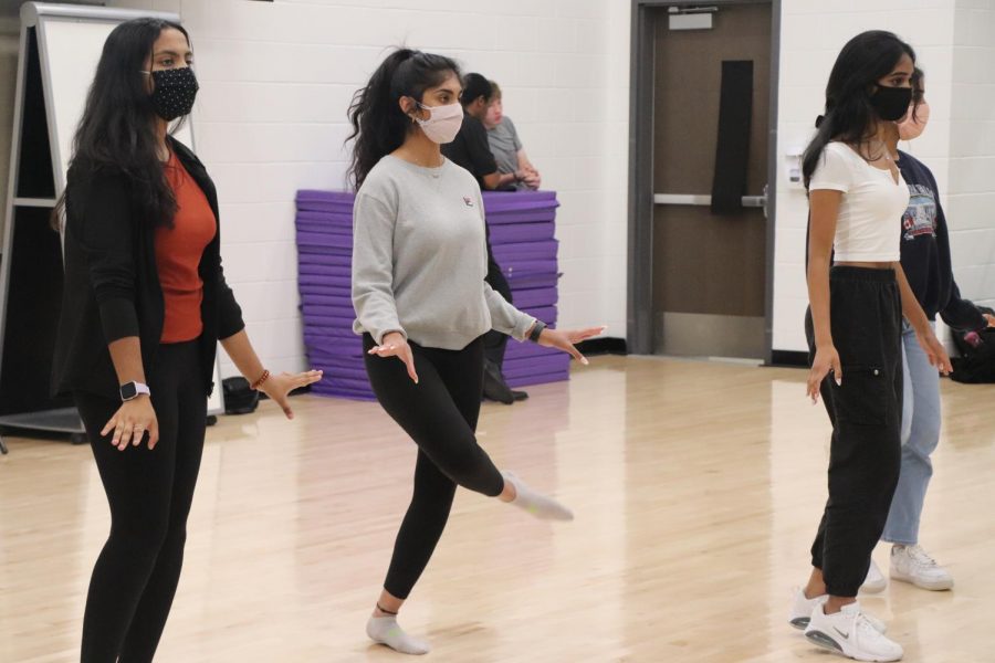 Bollywood dancers teach the choreography for "O Saki Saki" to interested members