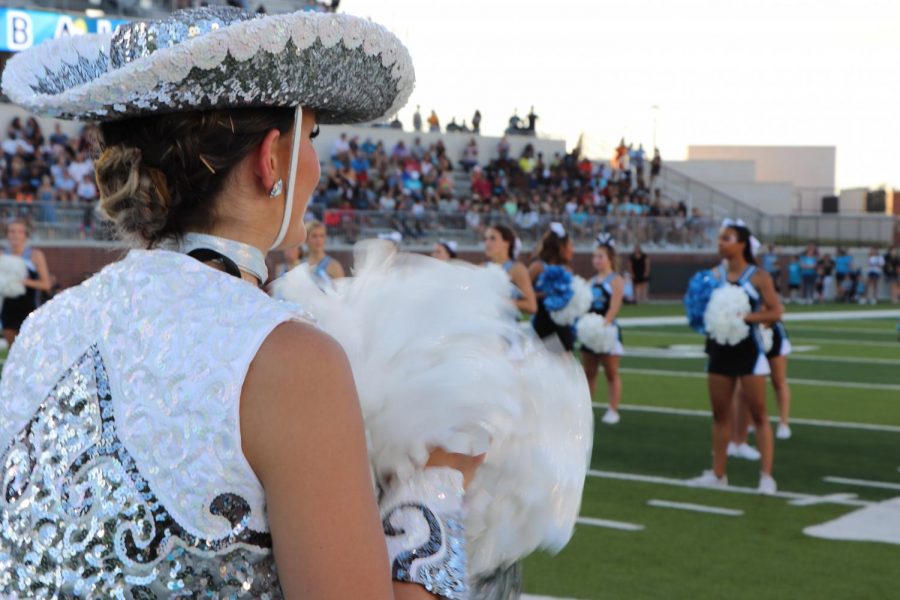 Cheerleaders and Rockettes cheering on the sports being introduced for this season.