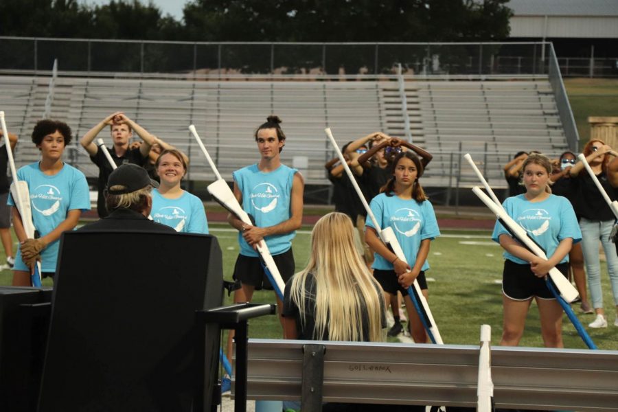 Editor-In-Chief Gianna Ortner-Findlay captures Color Guard as they prepared to showcase a snippet of their competition piece, Dreams of Icarus. "I like that you can learn something and that there's always going to be another layer that's harder." senior Trey Berliner said. Rock Hill Band's first competition is on Oct. 2nd at the Plano Marching Invitational.