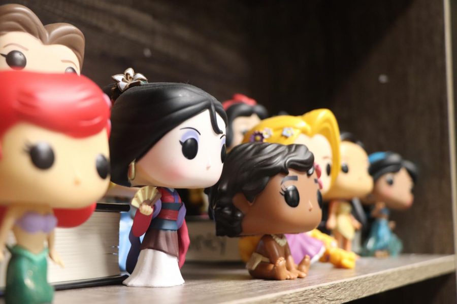 Photographer Dana Garcia captures a few of theatre director Sariea Haney's Funko Pops perched on a shelf in her office. "[Disney is] magic and it lets everyone feel like a kid again." Haney said. The theatre director loves to collect different types of Funko Pop characters, especially Disney. The shelves have different themes of Funko Pop's, and this one houses a few of the Disney Princesses.