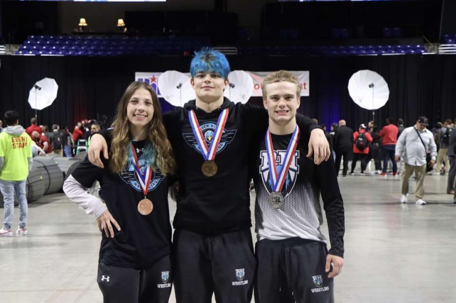 After receiving their medals, Juniors Brooke Wieczorek, Masyn Marble, and senior Xavier Jukes smile. All three teammates made the podium, with Wieczorek placing fifth, Marble placing third and Jukes placing second. Wieczorek said, "I could not have made it here without my team and my coaches. And I'm really grateful that they were all here for me to help me get this far."
