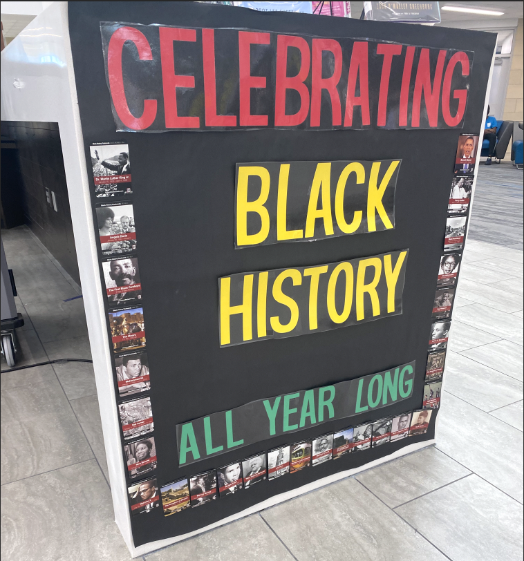 Editor-in-Chief Gianna Ortner-Findlay snaps a shot of the Black History Month display in Rock Hill High School's library. "Black History Month is observed from Feb. 1st-28th," Ortner-Findlay said, "and is a month that highlights and celebrates the historical influence that Blacks and Black Americans have had." Black History Month is an internationally observed holiday month; however, recognized at varying times of the year.