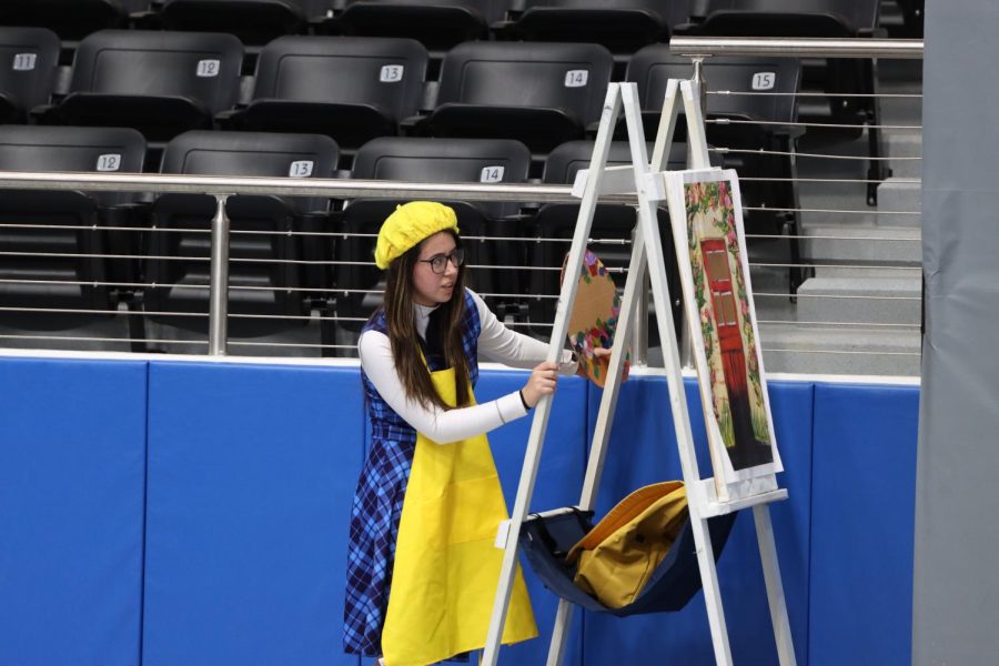 Senior, Isabella Trevino is a member of the Rock Hill Indoor Drumline which is a part of the Rock Hill Blue Hawk Band. I loved every single performance we did, because we got better after every single performance, Trevino said. Pictured, she was painting on an easel for the show titled, School Daze, which was performed during the indoor showcase on March 24.