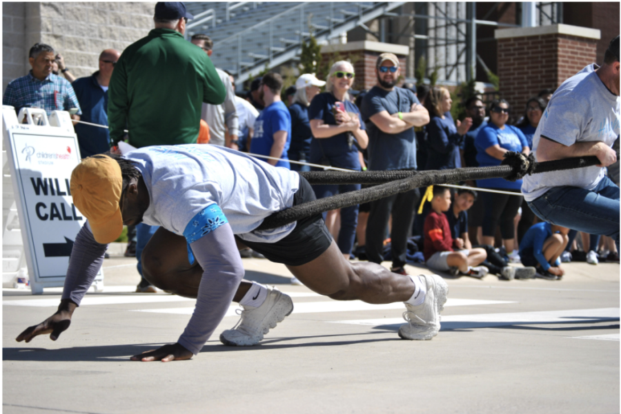 A Fire Truck Pull has several positions, including the photographed anchor. "I have never done [a fire truck pull] before," Rodriguez said, "So this is a new experience. Definitely. Super excited." The anchor of the pull starts the truck's momentum and is the foundation for a good haul.