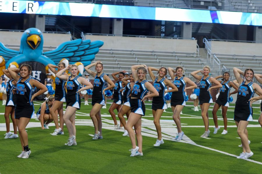 As their routine comes to an end, the cheer team poses facing the cheerful crowd. "Buy into the purpose of your team or program," senior and head cheer captain Nicole Bitner said. "Being fully committed will make your program more successful because everyone will work towards the same goal 100%." Bitner appreciates all who came to support the fall athletes, as it shows the love and spirit of Rock Hill.