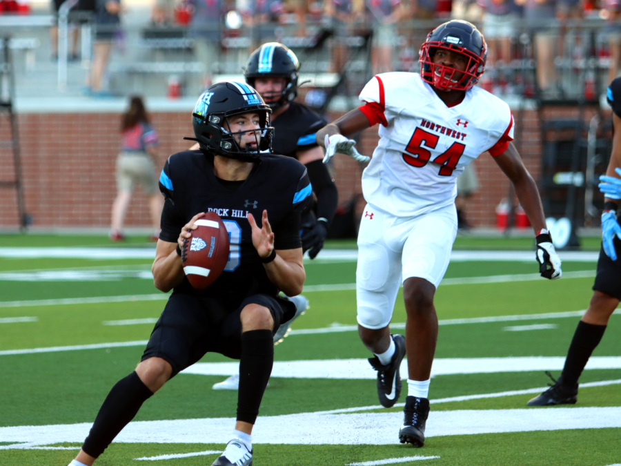 During the second quarter of the game against Justen Northwest, Sophomore Quarterback Kevin Sperry aligns his throw to the running back. Im very excited, and Im ready to showcase all my skills and lead the team to a lot of wins and a lot of success, Sperry said.