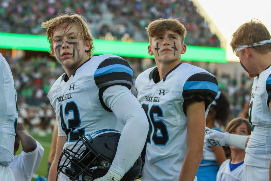 Junior Aj Hickey stands on the sidelines of the field with his teammates while waiting for the game to begin. "Personally, I didn't grow up here, but I know for a lot of the guys it was a big deal for them as they were excited to play against their friends," Hickey said. As a result of the animated crowd on the stands, Hickey wants to work on listening to the calls better and calming his nerves.