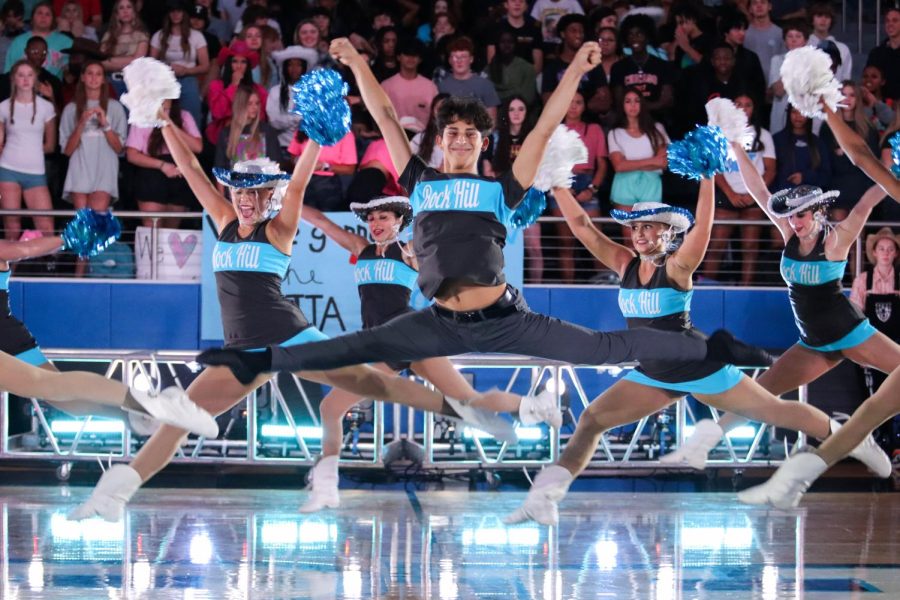 Leaping into the air, senior Rami Shihabi performs the Rockettes routine facing the seniors. "This season I hope to set a good example for years to come and see everyone improve throughout the year," Shihabi said. Shihabi has been on the team for three years now and is the captain of the Rockettes.