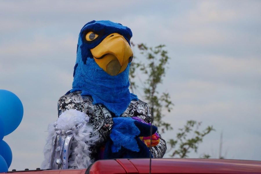 At the 2021 Homecoming parade, Rocky tosses candy to Prosper community members lined along the streets. This year Homecoming will occur on the second week of September. The dance will be on Saturday, Sept 17.