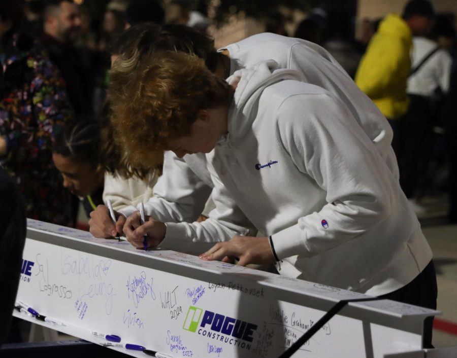 This student signs the beam with a friend, representing the meaningful bonds made in Prosper. Whether friends are separated or not, Blue Hawks or Wildcats, they will always be part of the Prosper community.