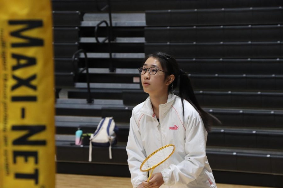 Junior Koharo Ito waits to return a serve during the badminton club’s first meeting after an informational session the previous day. “I wanted to play sports but didn’t want to try out,” Koharo said. “I am an exchange student from Japan, and I was part of the badminton club in my school there so wanted to join one here too.” Club leaders brought rackets, shuttlecocks and portable nets as members played in groups across the crowded gym. 