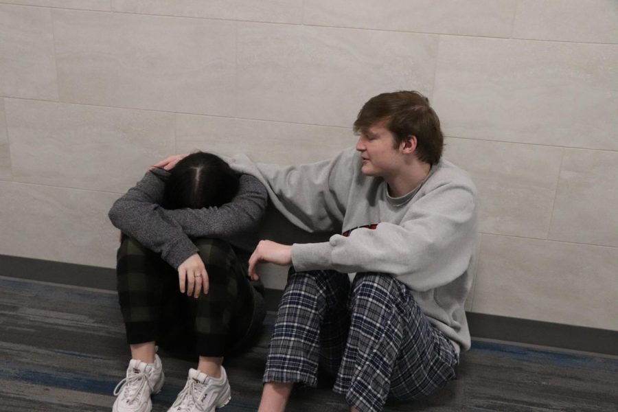 Hope Squad member and junior Ryder Hornsby comforts fellow classmate after a stressful day.