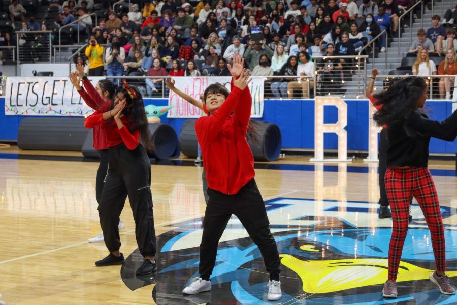 Members of the K-Pop Club make their first appearance at the pep rally as they perform their dance routine.