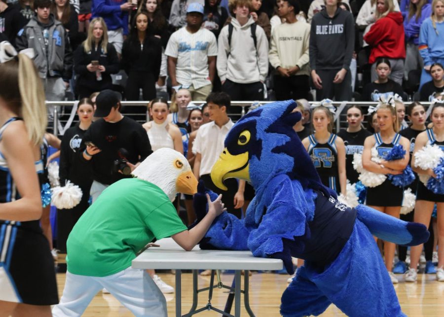 Rocky the Blue Hawk goes against Edgy the Eagle in an arm wrestling match. Rocky took the lead and earned the winner's belt. 