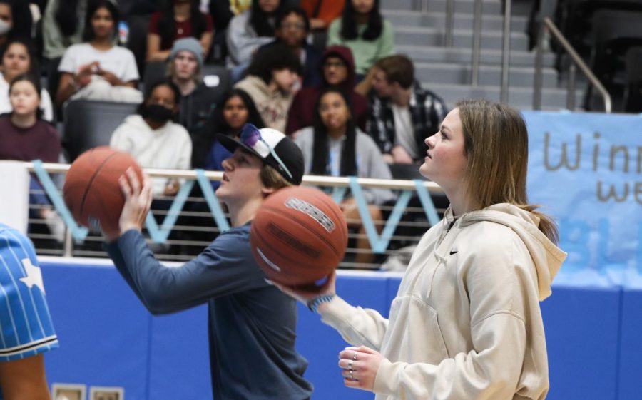 The freshmen and senior goes against each other in the finals in the basketball game during the pep rally.  