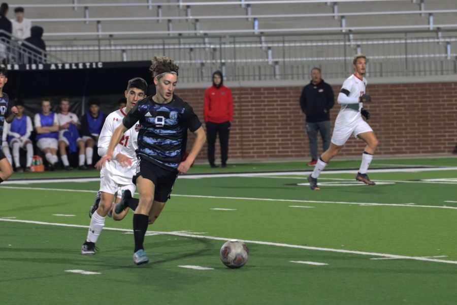 Senior forward Mateo Cabrera drives the ball away from his opponent. "The game didn't really go as expected," Cabrera said, "we definitely should have won." Cabrera scored two goals, one early on and another late in the second quarter. 