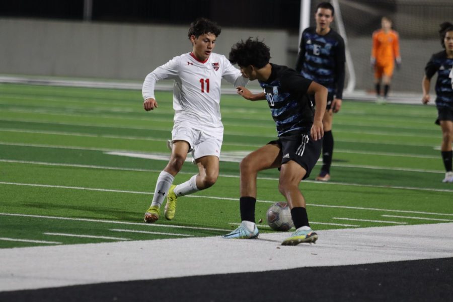 Senior Caleb Zavala braces as Braswell attempts to steal possession of the ball.  After a slow first half, both teams came in stronger for an intense second half. 