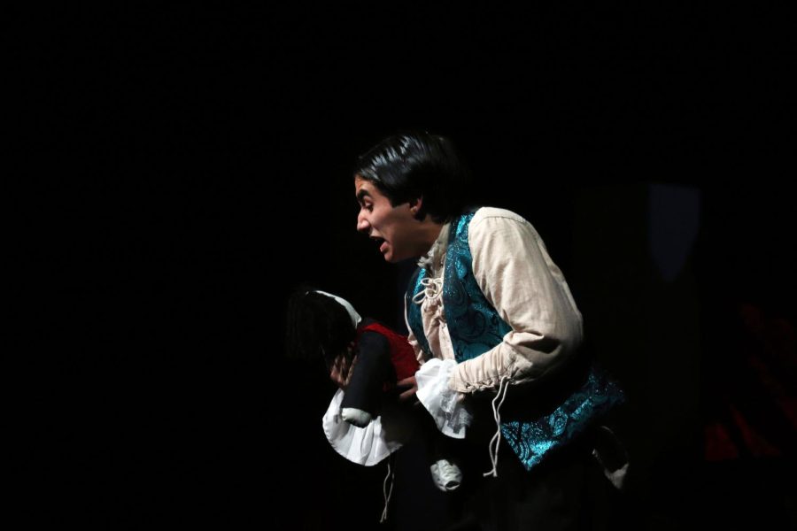 Sophomore Lyric Patino holds his character’s baby during an impassioned monologue in the title role of “Paganini,” Rock Hill Theater’s UIL One Act play. “Paganini” debuted on Tuesday, March 14 at 6:00 p.m. in the school auditorium.