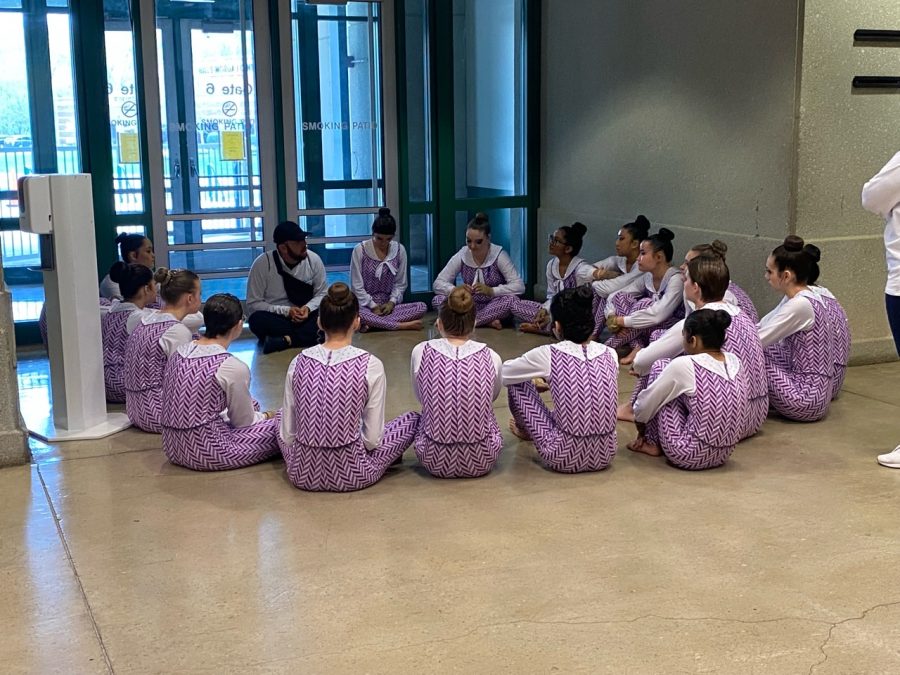 Before their WGI world championships performance, the Rock Hill Guard sits around in a circle cheering each other on. It feels really special to be the first group to go and represent not only our school but our town, Schmidt said. Its a very surreal feeling.  