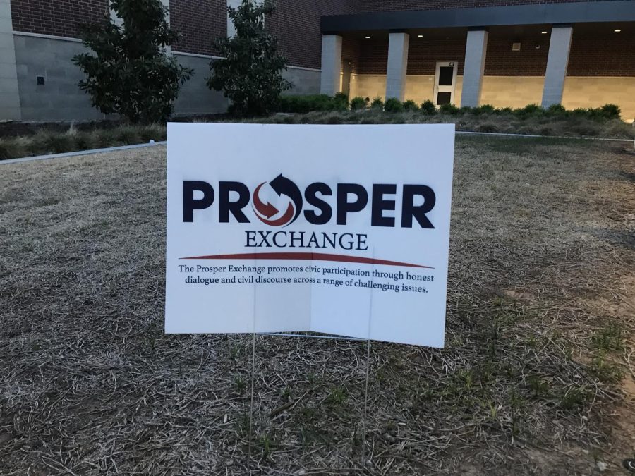 A sign guiding attendees to the entrance to the Prosper Exchange held in Rock Hill’s LGI room is put up in the front of the school. “We wanted to create something through which we can create a better citizenry by educating,” Prosper mayor David Bristol said. The Exchange took place on Thursday, April 13 and was the second event of the series.