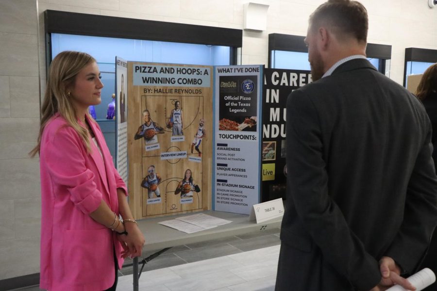 PHS senior Hallie Reynolds promotes her Pizza and Hoops for brand activation. 