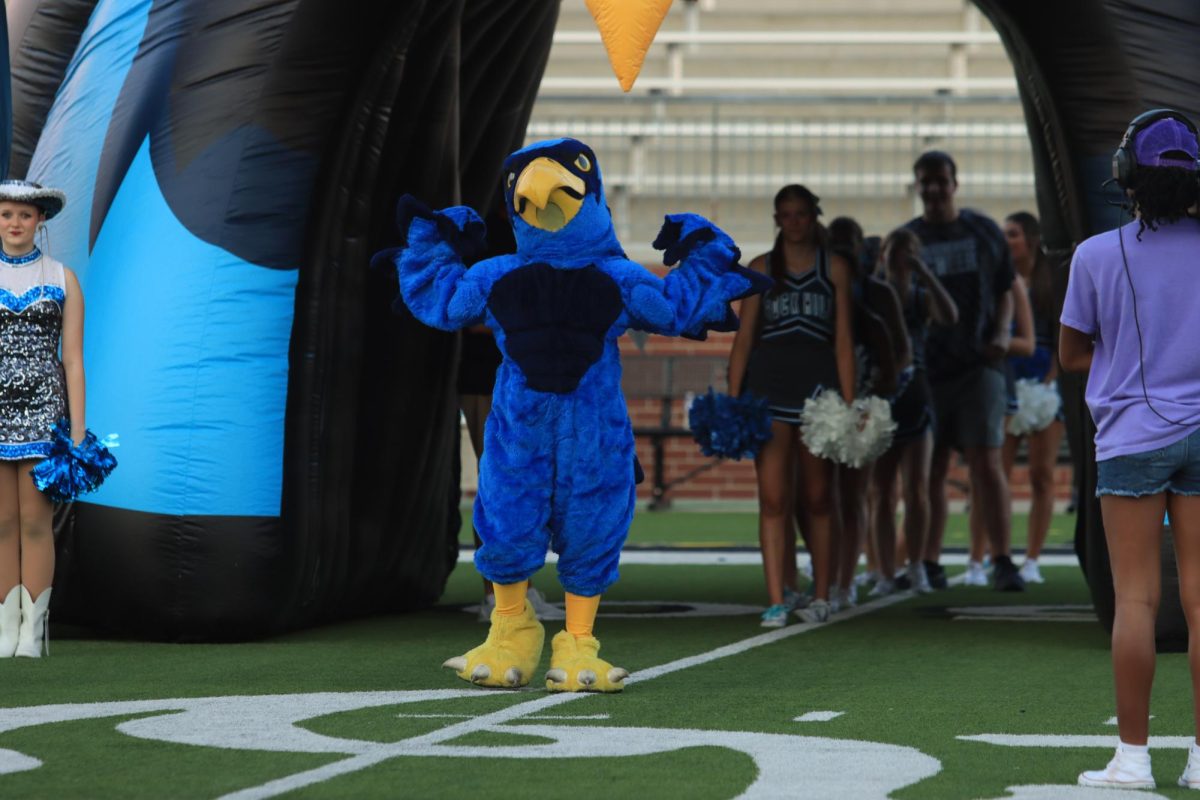 Ready to take on this year’s competition, school mascot Rocky stands with strong arms. 