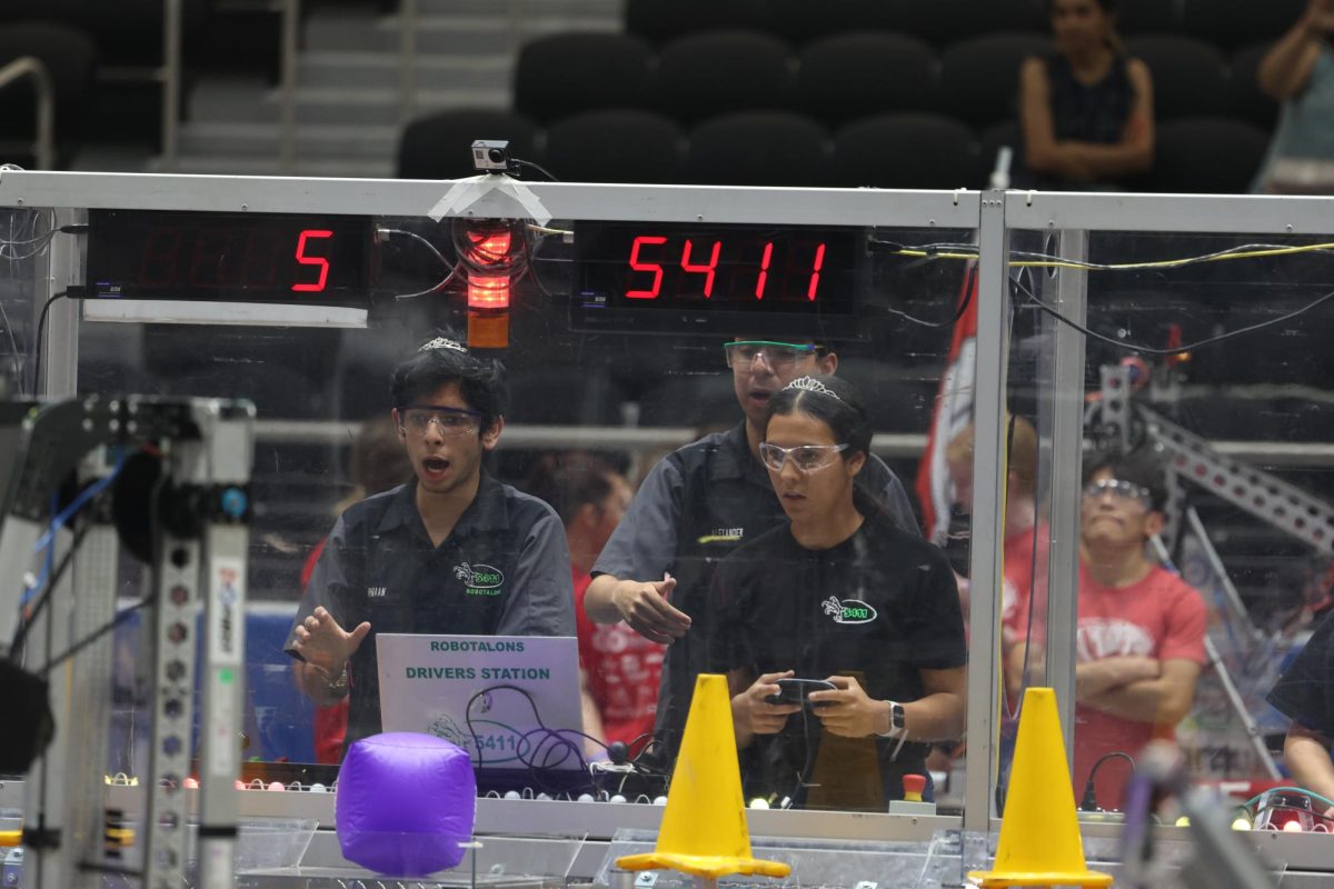 Junior Armaan Kakkar, Senior Natalia Cano, Junior Alex Philips, competiting in the Fight Like a Girl Tournament hosted by the Prosper Engineering Team. The FLaG Tournament invites female players to compete against each other. “ Recently, we had our first offseason competition (FLaG and TTT) where the girls had a lot of fun,” Co-Team LadyTalons Captain Junior Fatemeh Fardin.