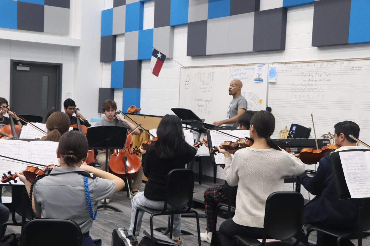 Senior Ethan Horsley is pictured playing cello in orchestra class. My main extracurricular is orchestra, Horsley said. I’ve been in orchestra every year throughout highschool.