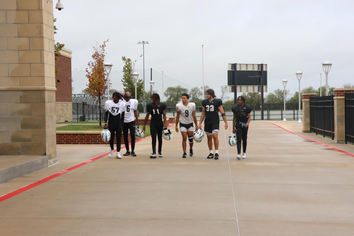 Seniors Chris Nguri, Nick Butler, Dylan Rhone, Victor Chionuma, Jonah Bowman, and Cyncere Lindsey walk inside together after morning football practice. We’ve all went through things off the field, and we’ve all dealt with that together,” Dylan Rhone said. “Being able to just vocalize that with each other helps our bond so much.”