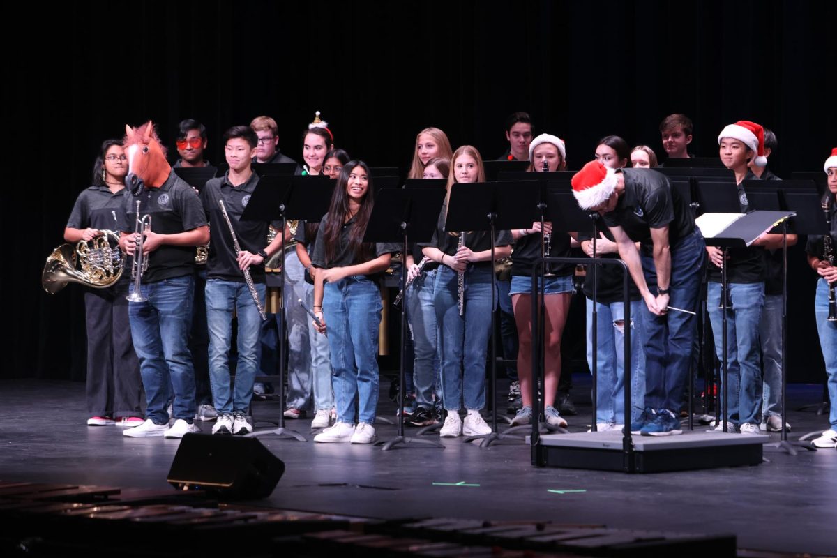 Taking a bow to end their performance, the Rock Hill band was the first to perform at the showcase. “Even as I walked onto the stage, I saw 8th grade band students I knew,” junior Max Lee said. “So my hope is that a familiar face for next year will inspire them and keep them in band for high school.” They performed the song “Sleigh Ride" as one of their songs.