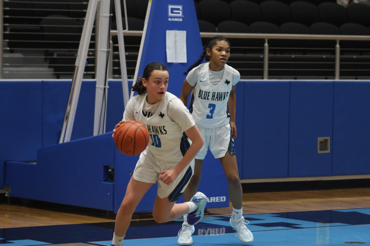 Freshman Sofia Read prepares to pass the ball to one of her teammates. Im the point guard, the point guard job is to facilitate everybody else on the court, Read said. She currently has one college offer to the University of the Incarnate Word (UIW). 