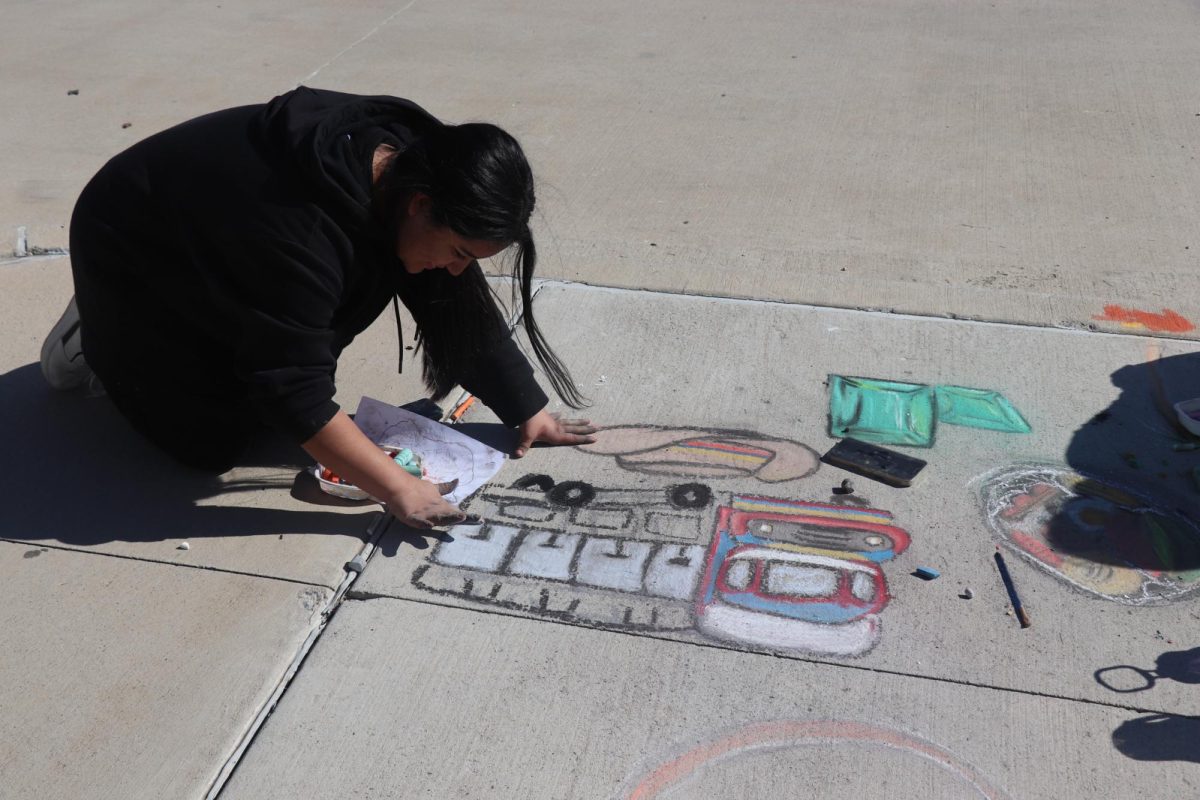 Transferring their artwork from paper to the sidewalk, this team showcases the dedication poured into their simple yet intricate designs.