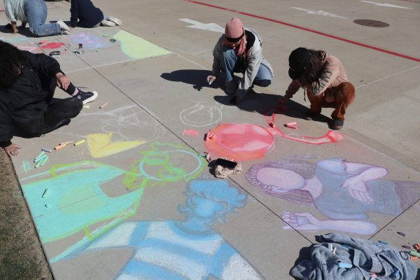 This team of three illustrates the diversity within a community through their depiction of various figures adorned in distinct colors.